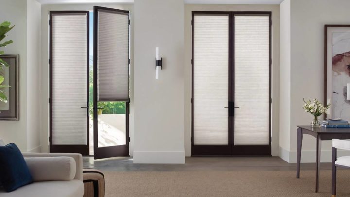 Hunter Douglas Duette® Cellular Shades on living room French doors, filtering light into the space at White House Designs For Life near New Jersey (NJ)