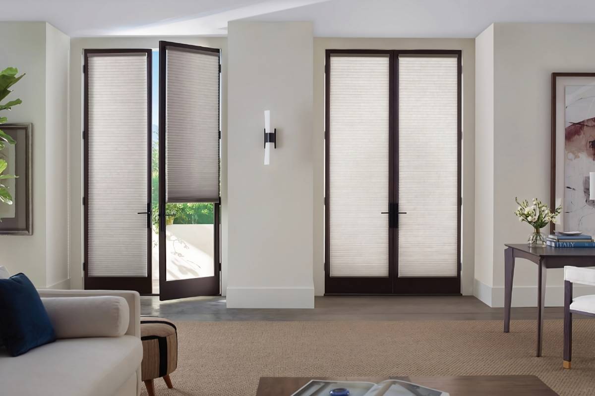 Hunter Douglas Duette® Cellular Shades on living room French doors, filtering light into the space at White House Designs For Life near New Jersey (NJ)