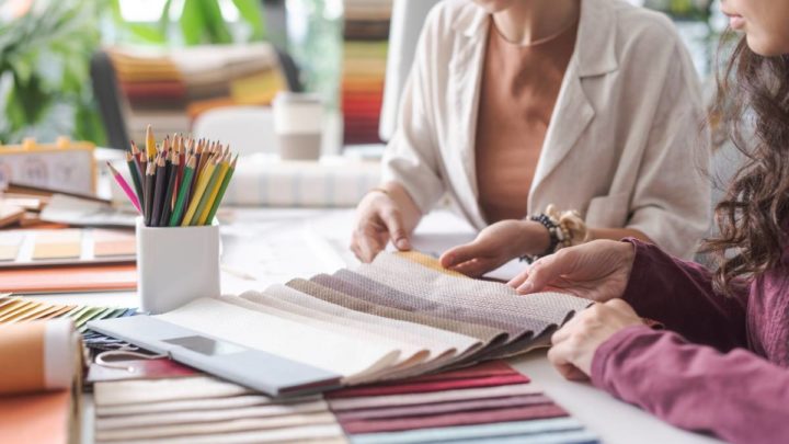 A custom window treatment expert working with a client, going over custom fabric swatches at White House Designs For Life near New Jersey (NJ)