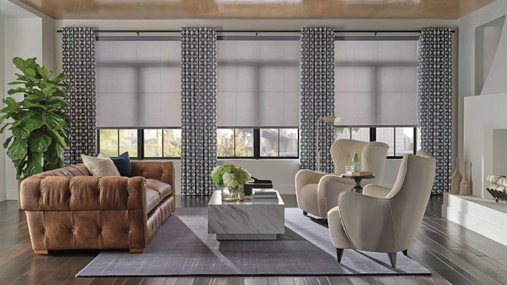 Hunter Douglas roller window shades paired with patterned drapes in a formal living room White House Designs for Life near Paramus, NJ