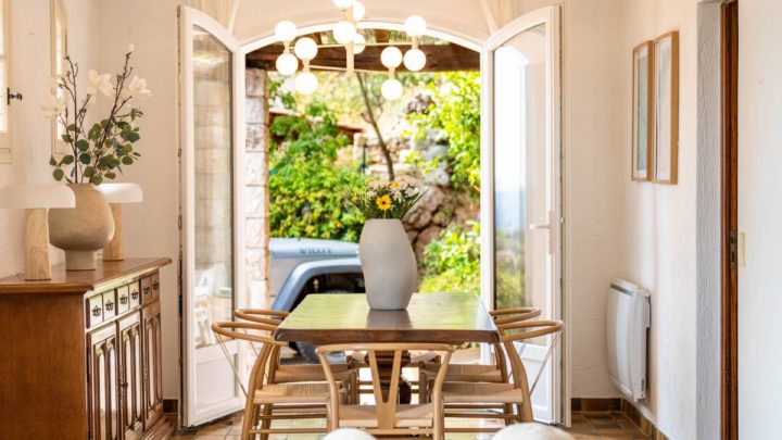A bright and airy dining room with stylish decor, table set, and buffet cabinet at White House Designs for Life near Paramus, NJ